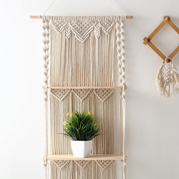 Macrame floating wall shelves with plant on second shelf