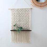 macrame shelf with plant 