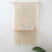 macrame shelf with book on the shelf